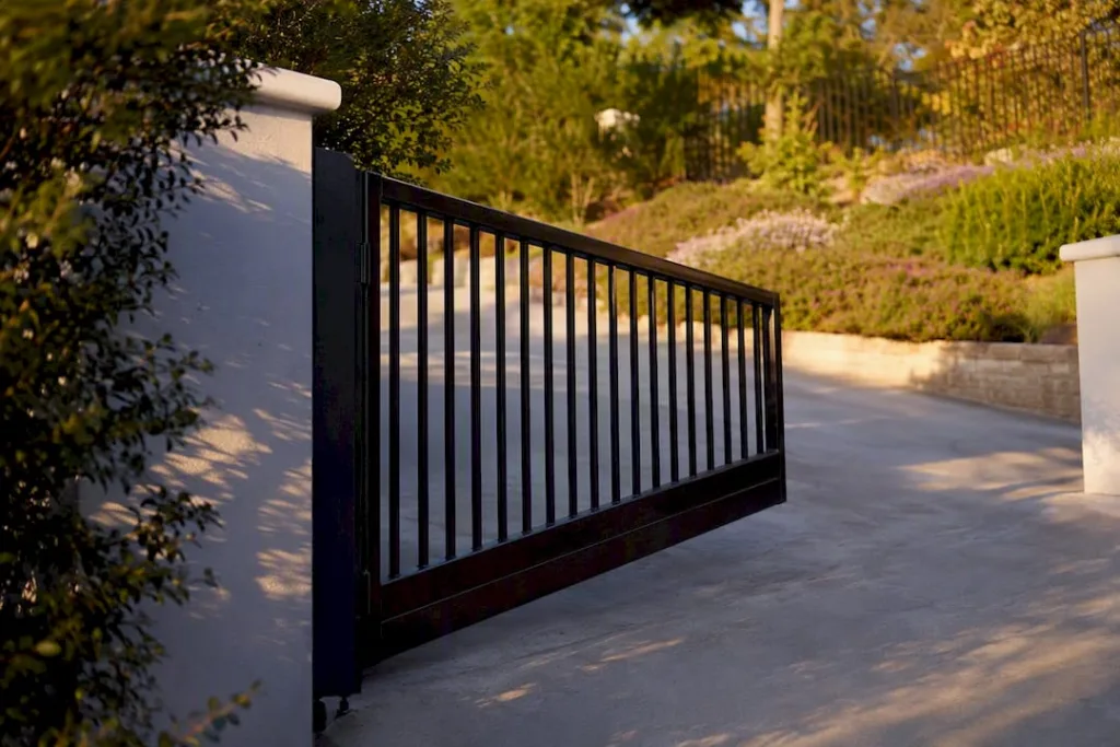 Raked bottom rail gate on a sloped driveway