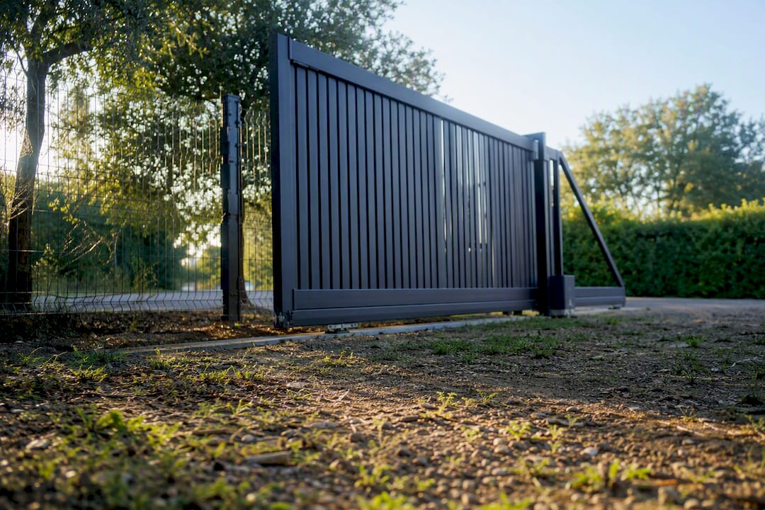 Cantilever sliding gate and ground track